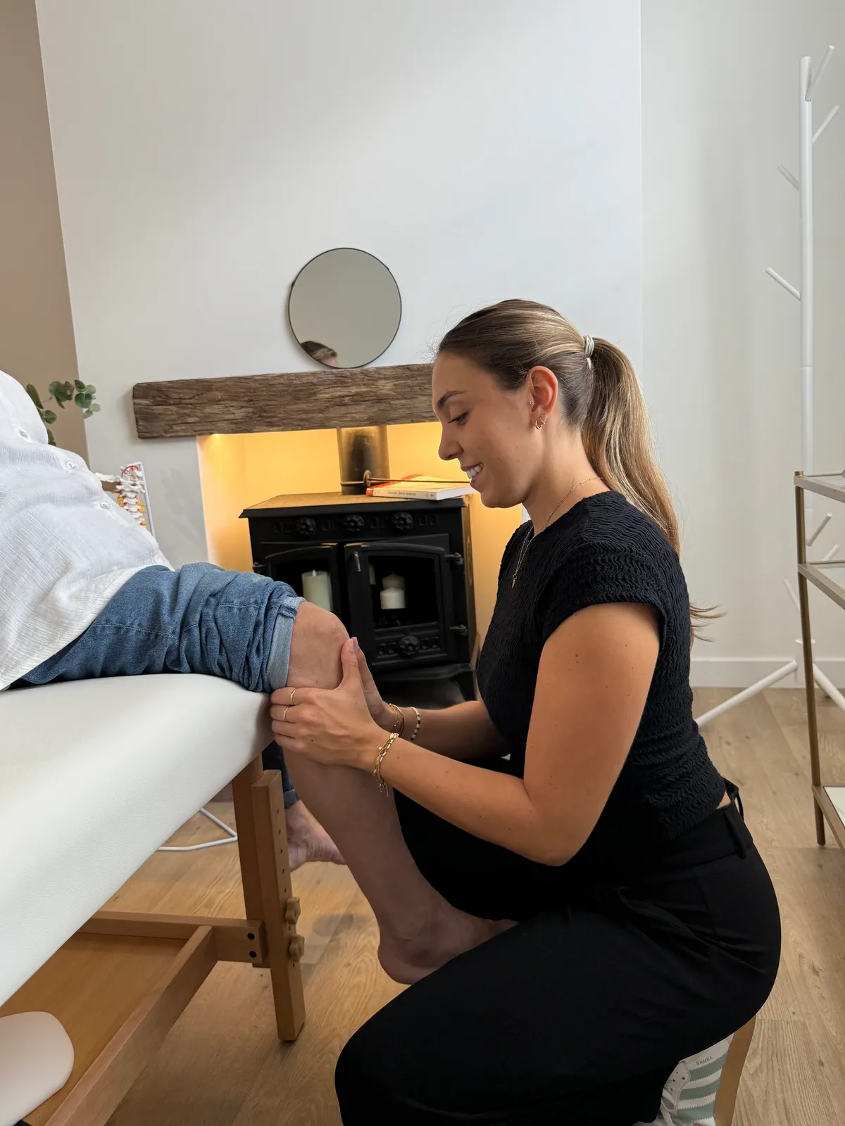 Dr Adriana assessing a patient's knee