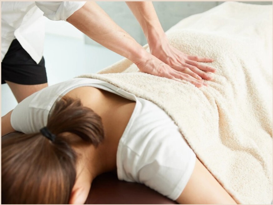 Chiropractor adjusting a patient's leg